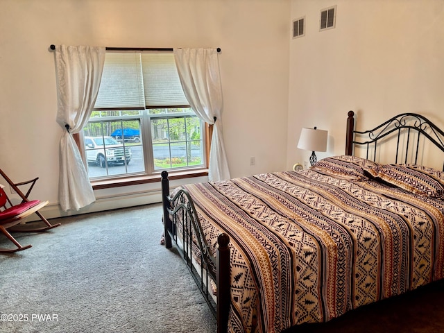 bedroom featuring visible vents and carpet floors