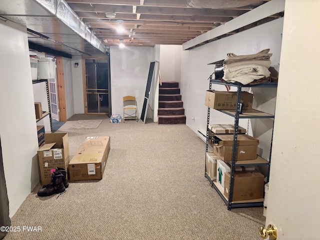 below grade area featuring stairway and carpet floors