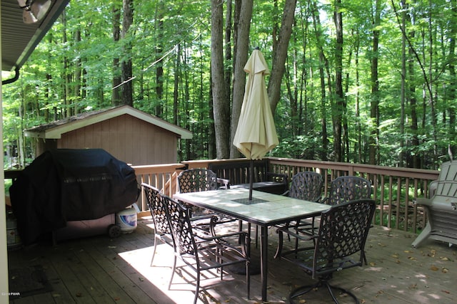 wooden terrace with area for grilling