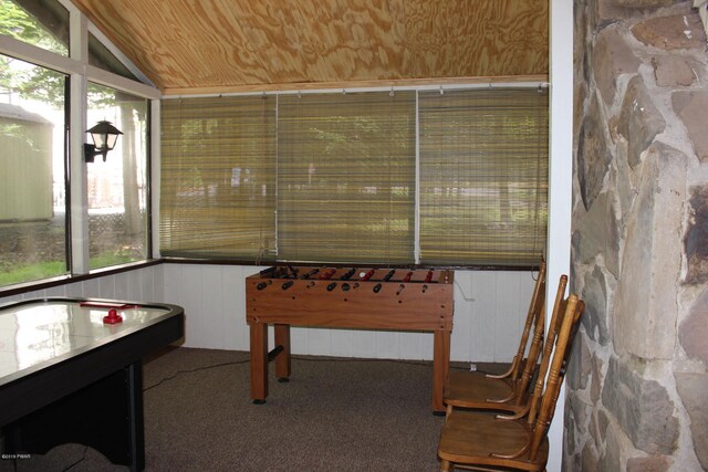 rec room featuring lofted ceiling, wood ceiling, and carpet floors