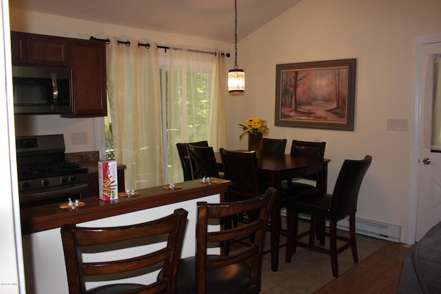 dining room featuring light tile patterned floors, a baseboard radiator, and lofted ceiling