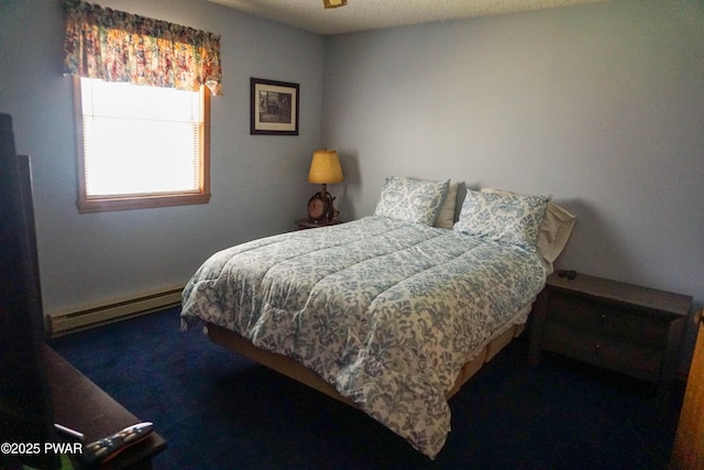 carpeted bedroom featuring baseboard heating
