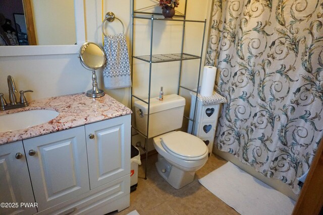 full bathroom with a shower with curtain, tile patterned floors, vanity, and toilet