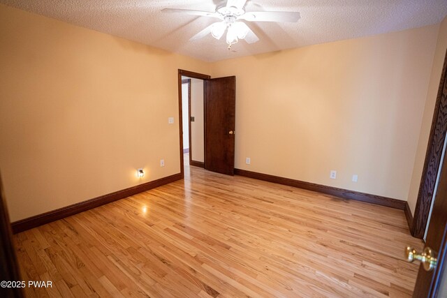 1111 Advent Rd, Lake Ariel, PA 18436 - unfurnished room with a textured ceiling, ceiling fan, light wood finished floors, and baseboards