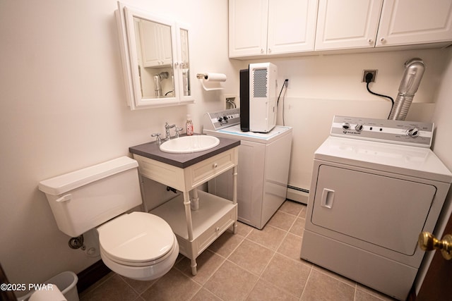 1111 Advent Rd, Lake Ariel, PA 18436 - laundry area with washer and dryer, light tile patterned flooring, and baseboard heating