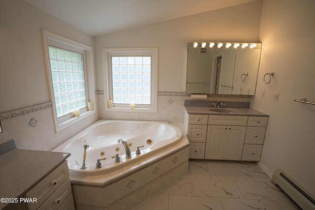 1111 Advent Rd, Lake Ariel, PA 18436 - bathroom featuring a baseboard radiator, marble finish flooring, lofted ceiling, vanity, and a whirlpool tub