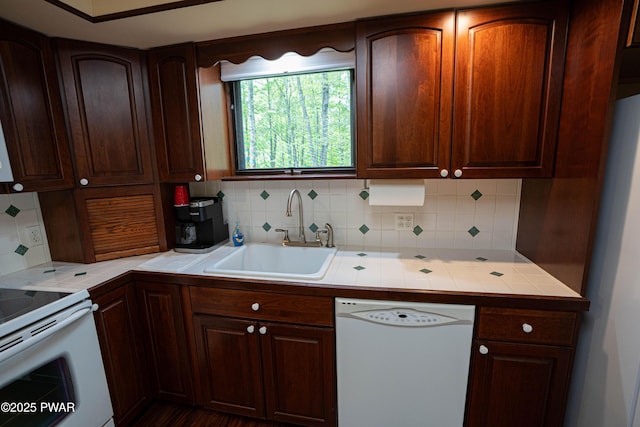 1111 Advent Rd, Lake Ariel, PA 18436 - kitchen with white appliances, a sink, tasteful backsplash, tile counters, and dark brown cabinets