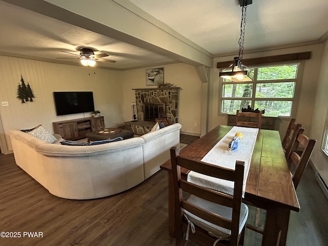 112 N Maple Ln, Greentown, PA 18426 - living area with dark wood-style floors, a stone fireplace, a ceiling fan, and crown molding