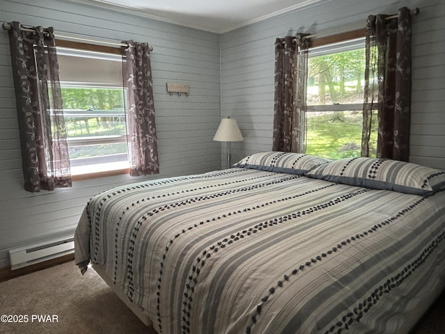 112 N Maple Ln, Greentown, PA 18426 - bedroom featuring a baseboard radiator, multiple windows, wooden walls, carpet, and ornamental molding