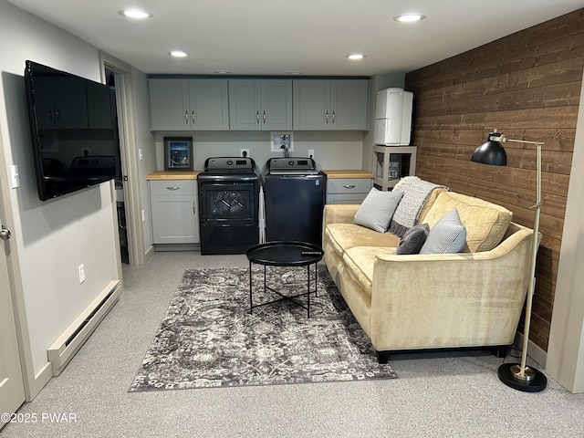 112 N Maple Ln, Greentown, PA 18426 - living area with a baseboard radiator, separate washer and dryer, wood walls, and recessed lighting