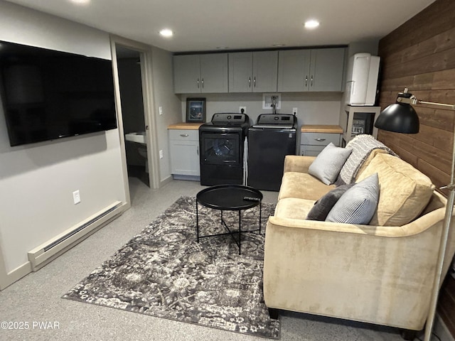112 N Maple Ln, Greentown, PA 18426 - living area with washing machine and dryer, a baseboard radiator, wooden walls, and recessed lighting
