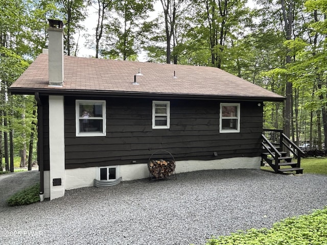 112 N Maple Ln, Greentown, PA 18426 - back of house featuring a chimney and a shingled roof