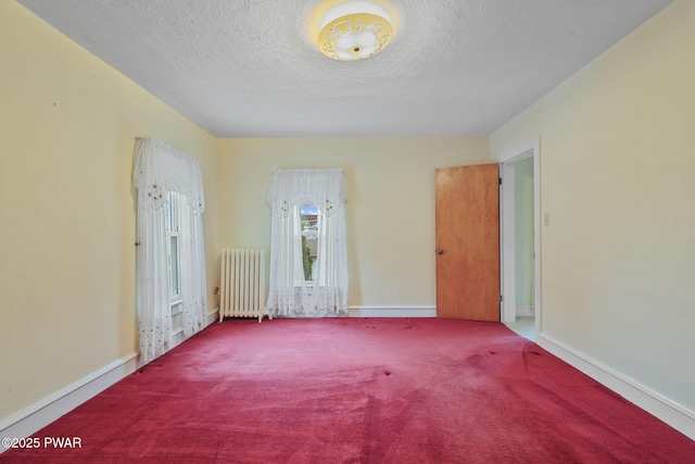 132 Dundaff St, Forest City, PA 18421 - carpeted spare room with radiator and a textured ceiling
