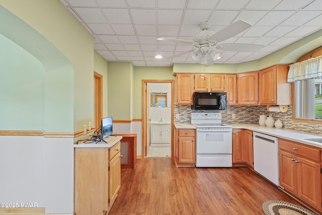 132 Dundaff St, Forest City, PA 18421 - kitchen with white appliances, light countertops, ceiling fan, light wood-style flooring, and backsplash