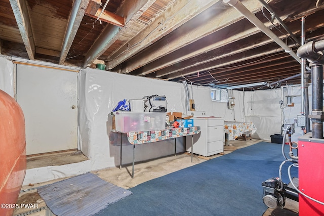 132 Dundaff St, Forest City, PA 18421 - unfinished basement featuring washing machine and clothes dryer and oil tank