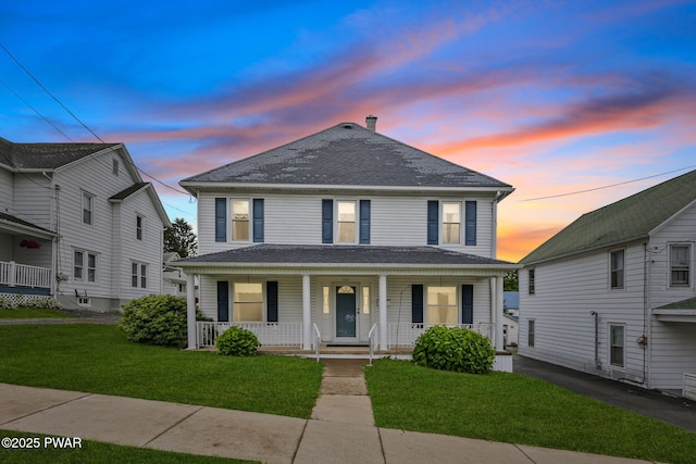 132 Dundaff St, Forest City, PA 18421 - view of front of house featuring a porch, a front yard, and a shingled roof