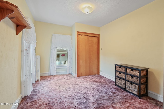 132 Dundaff St, Forest City, PA 18421 - unfurnished bedroom with carpet floors, a textured ceiling, and a closet