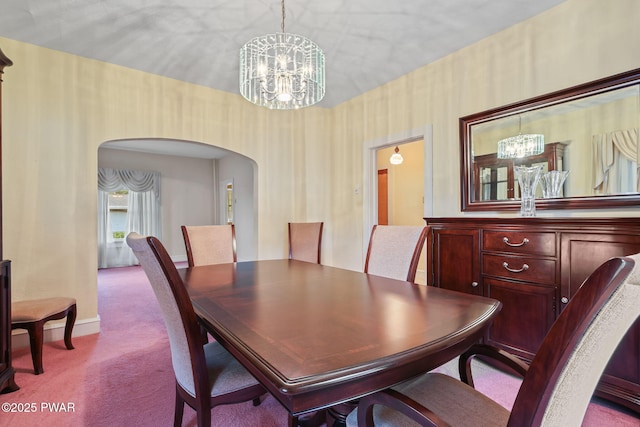 132 Dundaff St, Forest City, PA 18421 - carpeted dining room with a chandelier and arched walkways