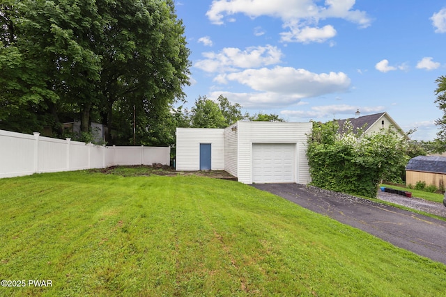 132 Dundaff St, Forest City, PA 18421 - view of yard featuring an outdoor structure, driveway, and a garage