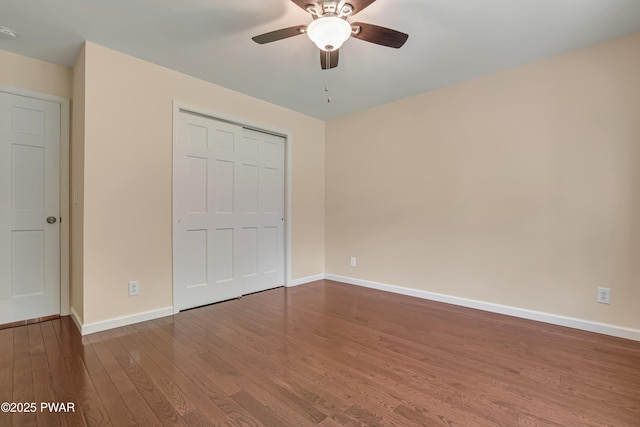 174 Lee Rd, Shohola, PA 18458 - unfurnished bedroom with wood finished floors, baseboards, a closet, and a ceiling fan