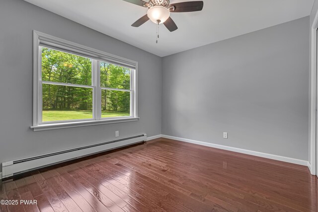 174 Lee Rd, Shohola, PA 18458 - unfurnished room with a baseboard heating unit, wood finished floors, baseboards, and ceiling fan