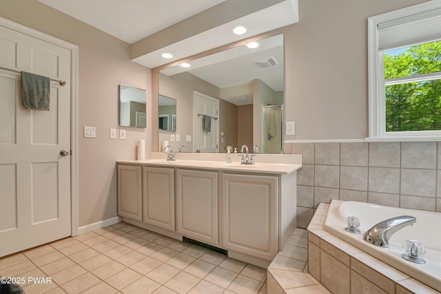 174 Lee Rd, Shohola, PA 18458 - full bathroom with a bath, double vanity, tile patterned flooring, recessed lighting, and a shower