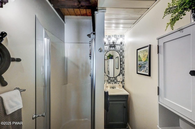 bathroom featuring vanity, beam ceiling, an enclosed shower, and wooden ceiling