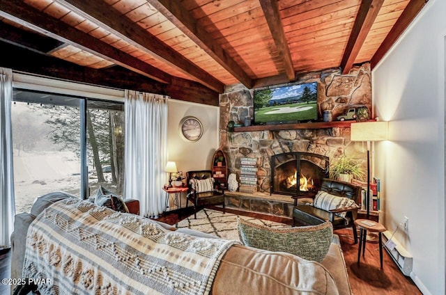 living room featuring beamed ceiling, a stone fireplace, hardwood / wood-style floors, and wooden ceiling