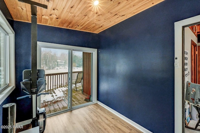 doorway featuring wood ceiling and wood-type flooring