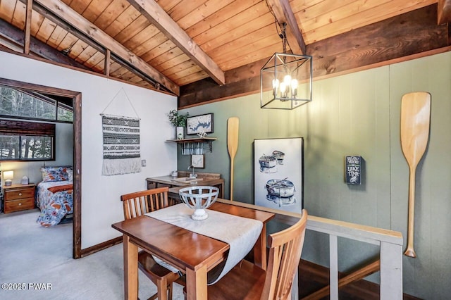 carpeted dining room featuring wood ceiling, sink, beam ceiling, and an inviting chandelier