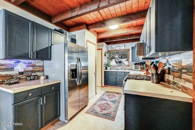 kitchen with beamed ceiling, stainless steel fridge, and wooden ceiling