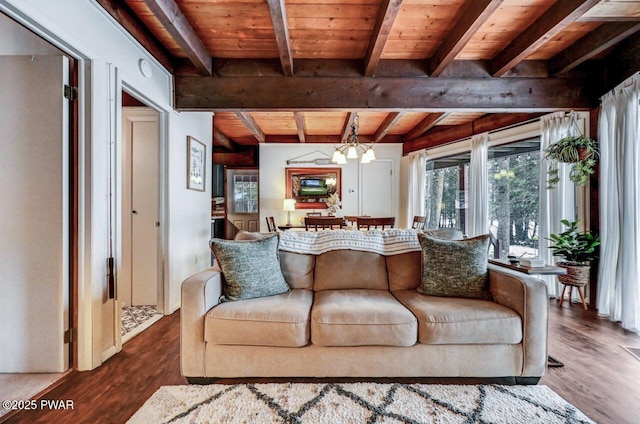 living room with an inviting chandelier, wood ceiling, wood-type flooring, and beamed ceiling