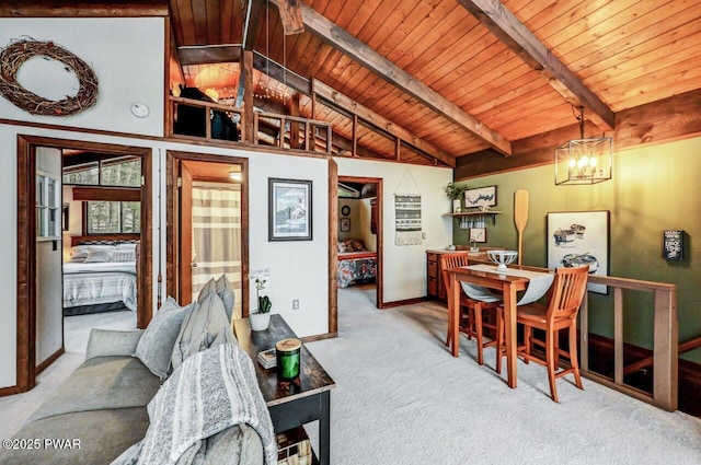 interior space featuring light colored carpet, a chandelier, lofted ceiling with beams, and wooden ceiling