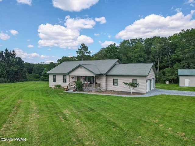 11 Coyote Rdg, Hawley, PA 18428 - ranch-style house featuring covered porch, a front lawn, a view of trees, and driveway