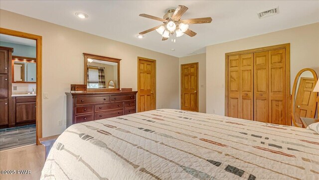 11 Coyote Rdg, Hawley, PA 18428 - bedroom featuring a closet, light wood finished floors, ensuite bath, a ceiling fan, and recessed lighting