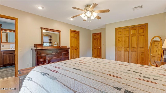 11 Coyote Rdg, Hawley, PA 18428 - bedroom with wood finished floors, a closet, connected bathroom, and a ceiling fan