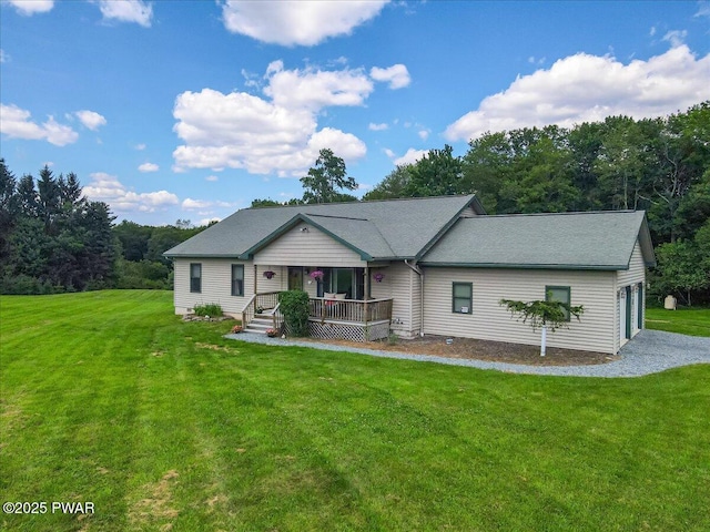 11 Coyote Rdg, Hawley, PA 18428 - view of front of house with a front yard, covered porch, and a garage