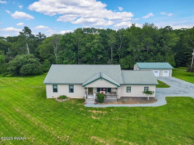 11 Coyote Rdg, Hawley, PA 18428 - view of front of home featuring covered porch, a front yard, a view of trees, a detached garage, and an outbuilding