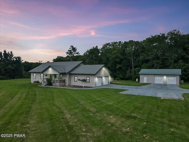 11 Coyote Rdg, Hawley, PA 18428 - ranch-style house with a front yard, an outbuilding, covered porch, and a garage