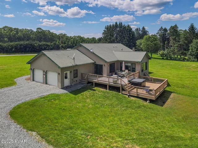 11 Coyote Rdg, Hawley, PA 18428 - back of house with a yard, a wooden deck, a garage, and driveway