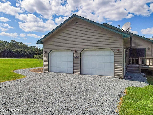 11 Coyote Rdg, Hawley, PA 18428 - view of home's exterior featuring a yard, gravel driveway, and a garage
