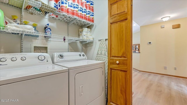 11 Coyote Rdg, Hawley, PA 18428 - washroom with independent washer and dryer and light wood-type flooring