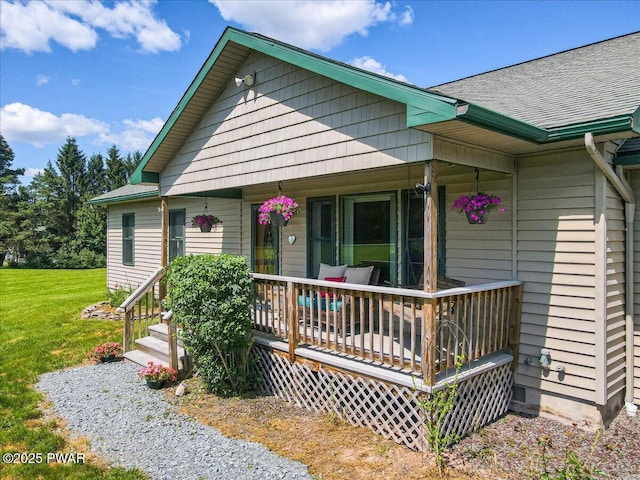 11 Coyote Rdg, Hawley, PA 18428 - view of front of property with a front yard, a porch, and roof with shingles