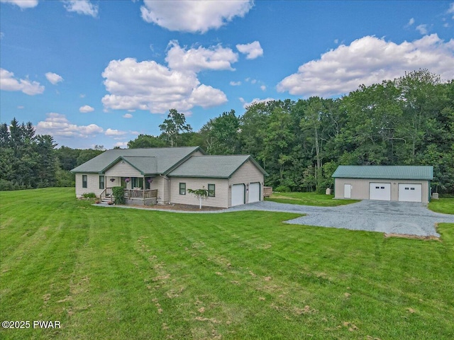 11 Coyote Rdg, Hawley, PA 18428 - single story home with covered porch, a front lawn, a wooded view, a garage, and an outbuilding