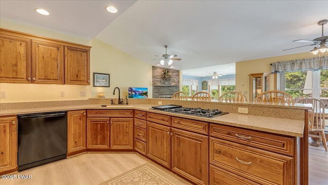 11 Coyote Rdg, Hawley, PA 18428 - kitchen featuring black dishwasher, a ceiling fan, lofted ceiling, light wood-style flooring, and gas stovetop