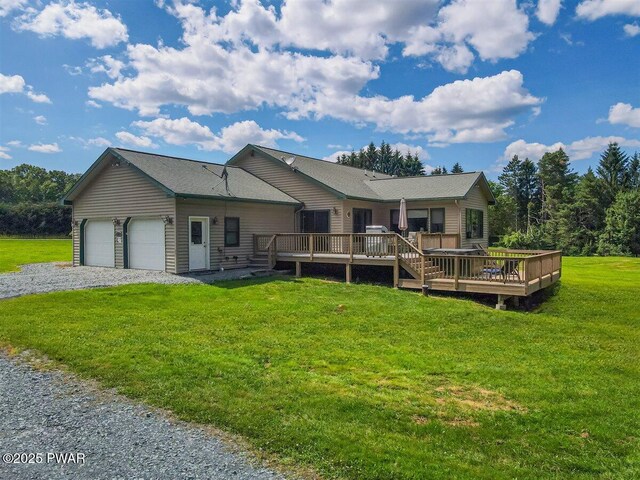 11 Coyote Rdg, Hawley, PA 18428 - rear view of house with a wooden deck, a garage, a yard, and driveway