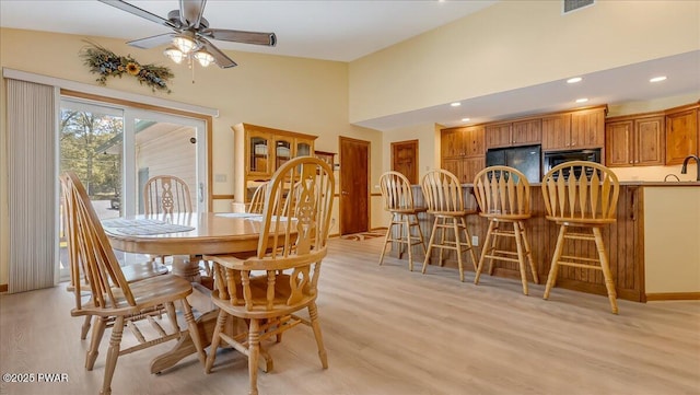 11 Coyote Rdg, Hawley, PA 18428 - dining area with light wood finished floors, a ceiling fan, recessed lighting, and high vaulted ceiling
