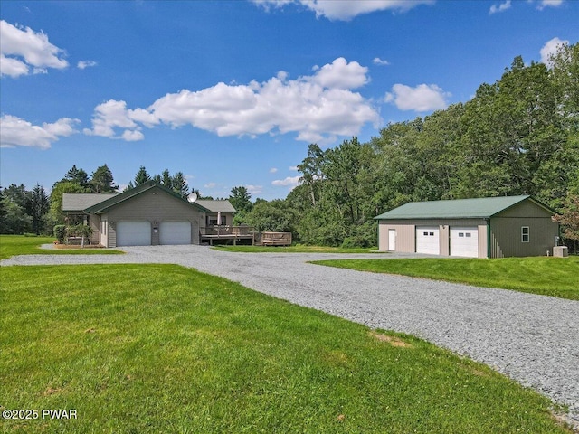 11 Coyote Rdg, Hawley, PA 18428 - ranch-style house featuring a front yard, a garage, and an outdoor structure