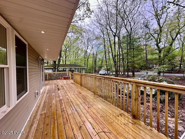 404 Forest Dr, Lords Valley, PA 18428 - wooden deck featuring view of wooded area