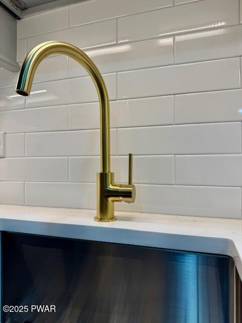 404 Forest Dr, Lords Valley, PA 18428 - detailed view of a sink and decorative backsplash